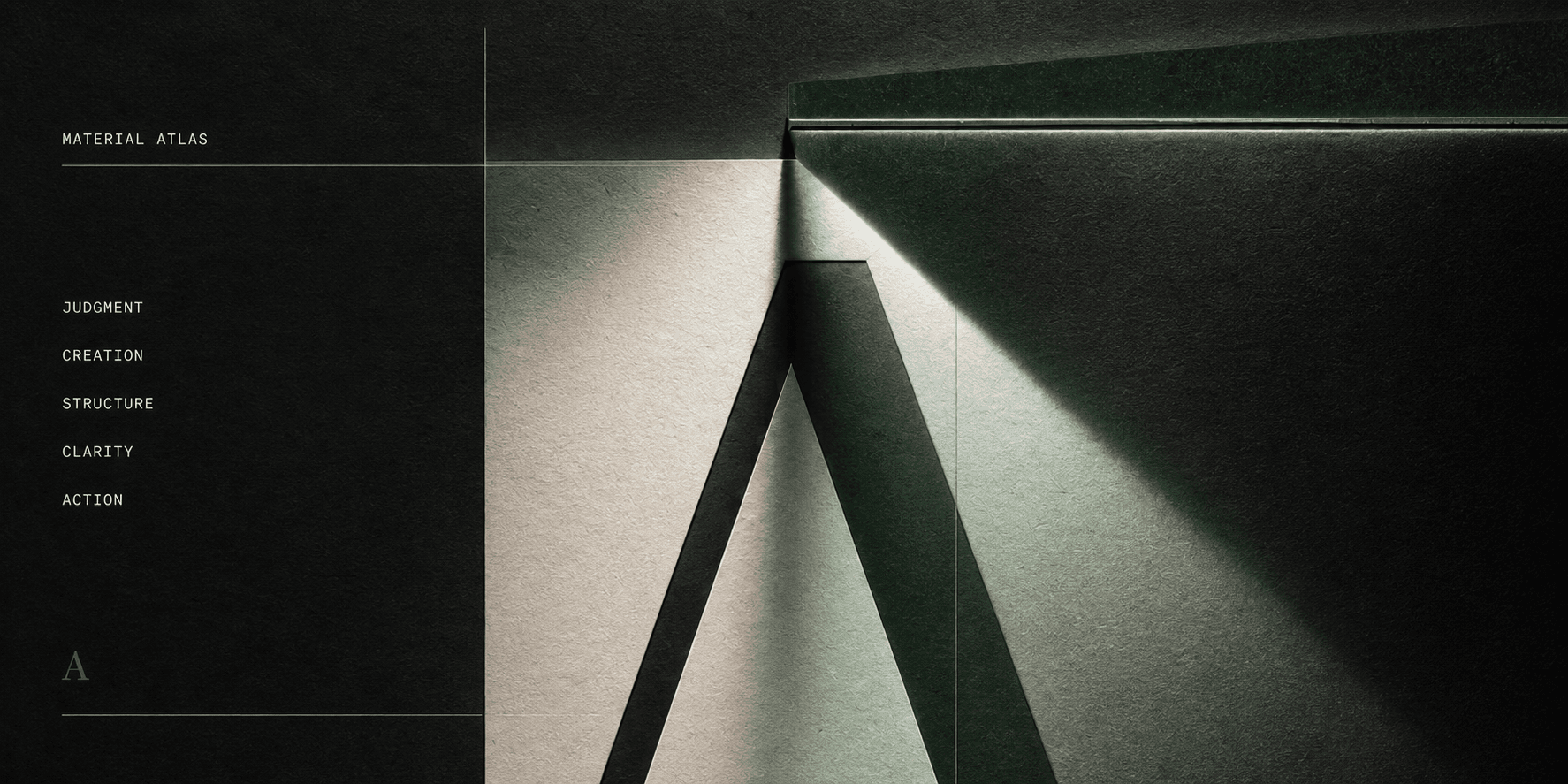 A monumental letter A formed from ivory and graphite materials under a controlled green beam of light.